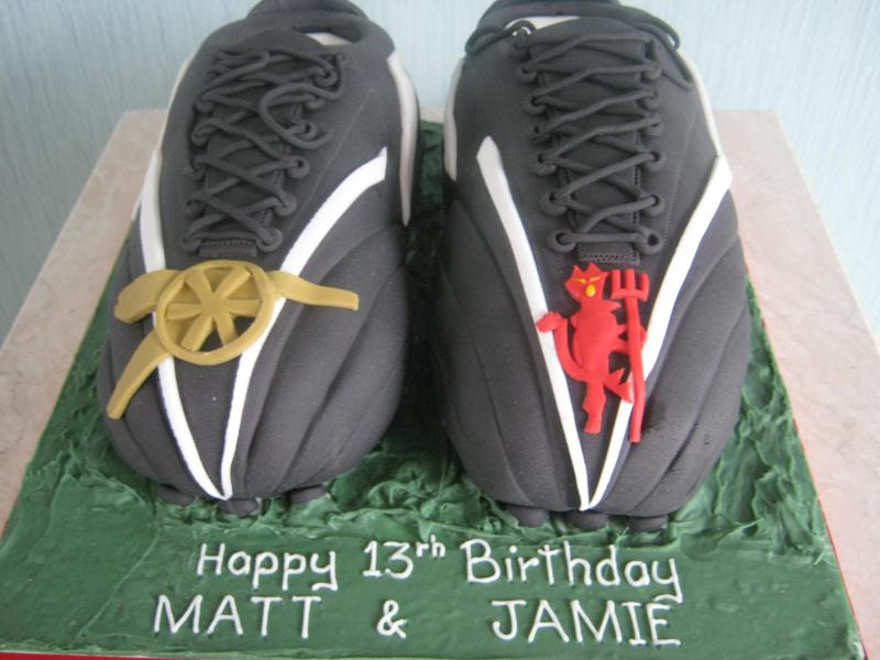 Arsenal and Man.Utd football boots for twin's 13th birthday in Lytham made from chocolate and vanilla sponges.