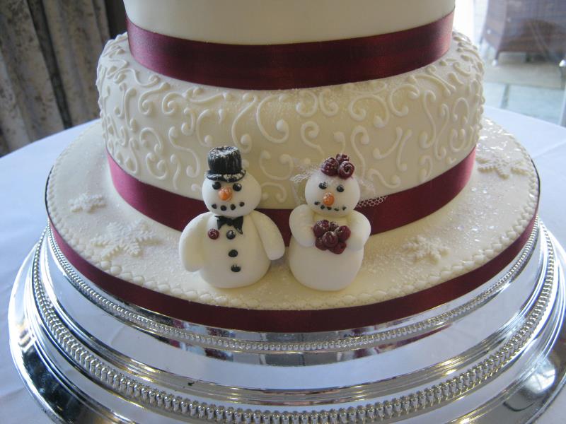 Burgandy wedding Cake -close up to show the Winter themed decorations