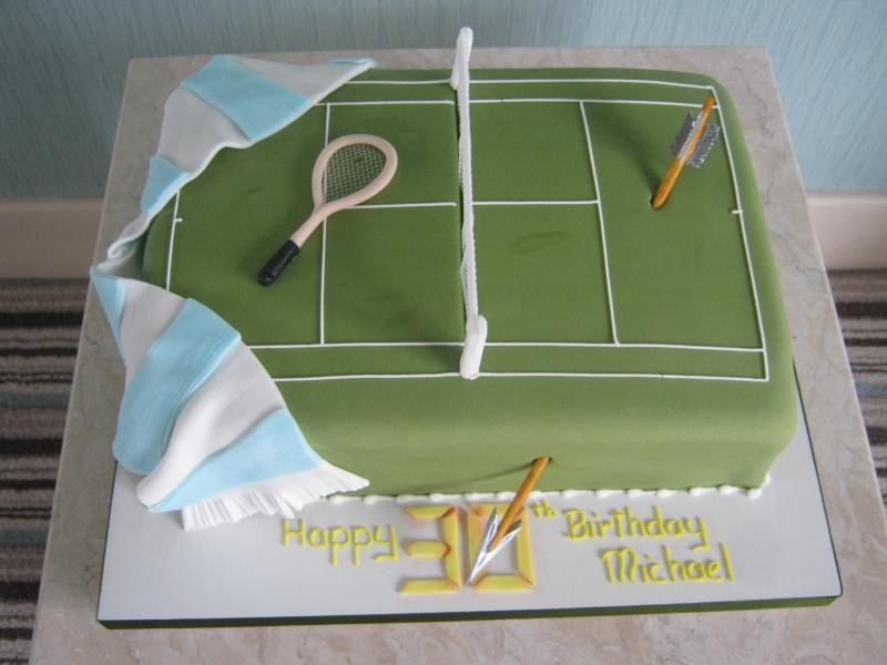Sport themed cake for Man City fan who is also into tennis and Arrow, made from vanilla sponge.