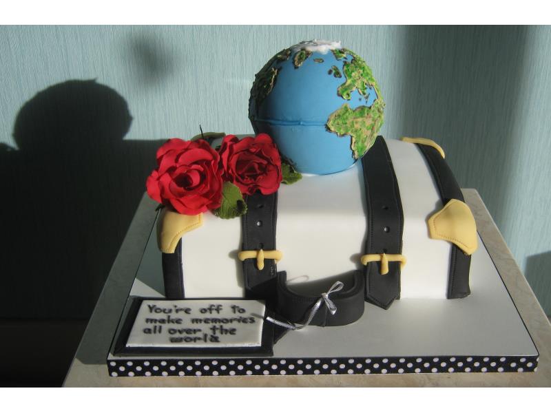 Emigrating and holidays themed, incorporating suitcase and globe in vanilla sponge Lytham St Annes
