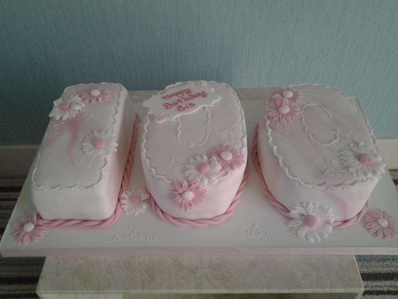 Cis - 100th birthday cake in pink marbled icing in Madeira for lady in Lytham