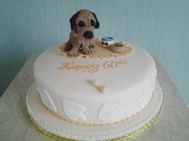 Buddy - Kath's pet dog Buddy on Kath's birthday cake in plain sponge for party at Center Parcs, Cumbria