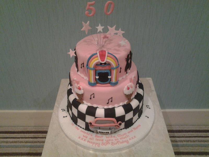 50s themed cake in pink with jukebox for Natalie's suprise 50th birthday party at North Shore Golf Club, Bispham. Made from Madeira and choc sponges.