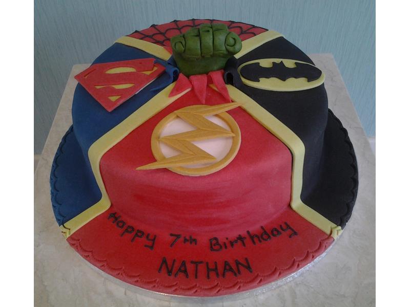 Superman and Batman logos made to Nathan's own design for his birthday in Blackpool. Made from plain sponge