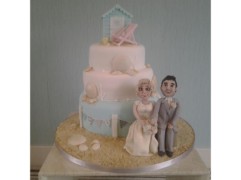 Beach scene - wedding cake with beach hut, deckchair, sand and sea shells for Chantelle's wedding at Ribby Hall, made from chocolate & orange sponge.