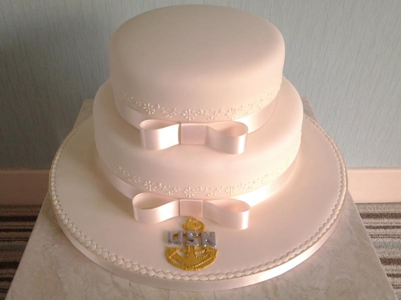 2 tier wedding cake, simple and classy for Swee Poh & Eric's wedding at Imperial Hotel, Blackpool. Bearing the crest of US Navy Chief Petty Officer