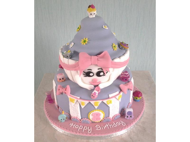 Shopkins themed 2 tier birthday cake including giant cupcake for Kiera in Staining. Made from cholcolate sponge.