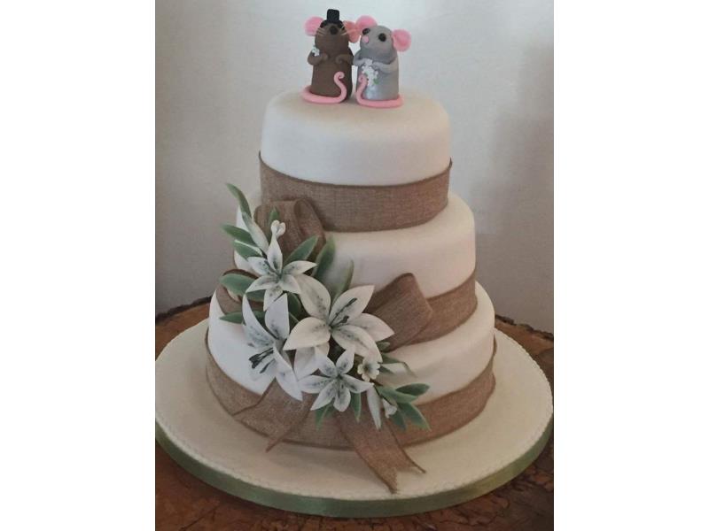 Hessian 3 tier Wedding Cakein vanilla, chocolate and lemon soponges with Lillies to celebrate Katy's & Lee's wedding in Blackpool