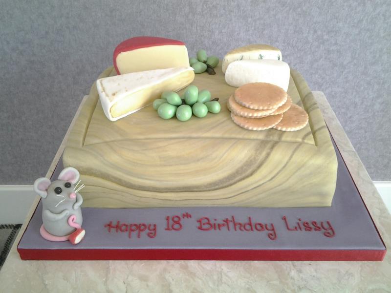 Cheeseboard with all items created from sugarpaste on a chocolate with orange sponge cake for Lissy in Blackpool