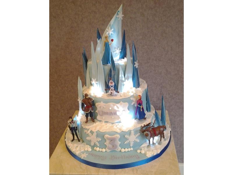 Frozen with lights - 3 tier vanilla sponge on the Frozentheme with lighs and shards for Olivia's birthday in Accrington