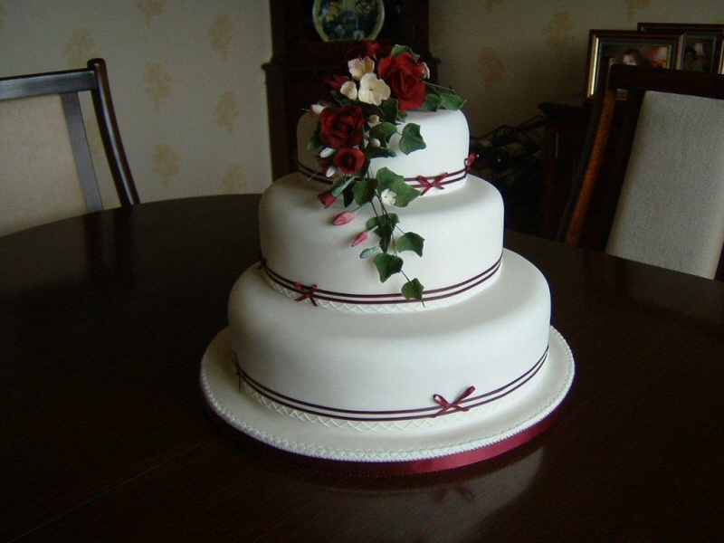 Photo Ruby 3 tier ivory sugarpaste wedding cake with freesias 