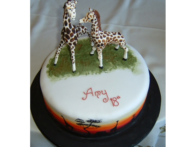 Amy - 18th birthday cake with modelled giraffes and an African sunset around the side