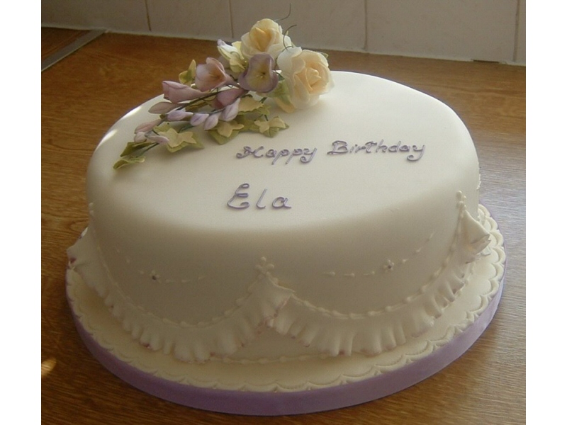 Ela - Cream and lilac birthday cake with freesia and rose handmade suger flowers