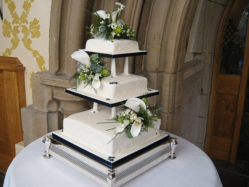 Kathryn - 3 tier square wedding cake decorated with arum lilies and snow berries for Kathryn and Ian in Chipping, Preston.