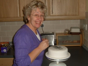 Photo - Sue Summers (me) working on a cake